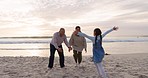 Grandparents, child and family hug at beach for fun vacation, holiday or adventure at sunset. Senior man, woman and a girl kid together at ocean for quality time with love and care outdoor in nature