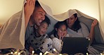 Laptop, parents and children in bed for movie at night, cartoon and streaming television show with smile at home. Mother, father and kids in bedroom to watch tv, relax and bonding with online video.