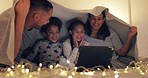 Laptop, parents and kids in bed for movie at night, streaming television show and smile at home. Mother, father and children in bedroom at sleepover to watch tv, relax and bonding with online video.