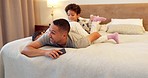 Dad, relax and excited kids with energy in bedroom with father for bonding, playing or fun in home on the weekend. Happy, family or children together for quality time or jumping on the bed in morning