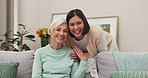 Face, elderly mother and woman on sofa in home living room bonding together. Senior mom, portrait and people smile, adult daughter and family women with love, care and quality time in house lounge