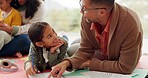 Girl kid, dad and homework on floor, writing or helping hand for for education, teaching and support. Parents, young children and together with kindness, learning and care for studying in family home