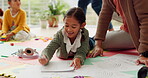 Girl kids, parents and writing homework on floor, tablet or helping hand for for education, teaching and support. Children, mother and father with kindness, elearning or care for study in family home