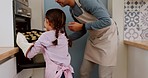 Kitchen, oven or baking father and child load cookie tray, candy sweets or biscuits for breakfast, lunch or brunch dessert. Home support help, family dad or hungry kid girl learning cooking from papa