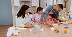 Happy parents teaching children baking as care in a home kitchen counter together to prepare dessert as a skill. Development, mother and father helping kids learning a cookies recipe or food