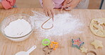 Heart, flour and child hands baking shape as love symbol or sign on kitchen table or counter while cooking dessert in home. Bakery, learning and parent help or teaching kid to make cookies as support