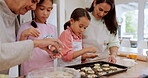 Grandma, mother and kids learning baking in a home kitchen counter together to prepare dessert as a skill or care. Family, mom and girls teaching or helping children with a cookies recipe or food