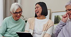 Tablet, funny and a carer with senior women in a retirement home or assisted living community. Technology, health or medical and elderly friends in the living room together with a happy female nurse