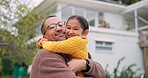 Father, child and family hug outdoor in a backyard with a smile, happiness and love. Portrait of happy man and girl kid or daughter together for support, quality time and bonding with care at a house