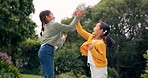 High five, playing and excited children in park together, jumping games and sisters in nature. Love, fun and happy kids in garden, celebrate bonding with smile and trees in yard of new home