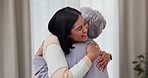 Greeting, hug and mother and daughter in house for a visit, bonding and love in a nursing home. Smile, family and a senior mom with a woman, care and gratitude in a living room together in retirement