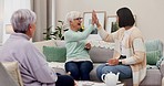 Senior women, group and cards in retirement, high five or winning with young lady, gambling or success in lounge. Elderly friends, casino game and motivation for care, bonding or love in nursing home