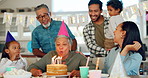 Birthday, party and an elderly woman with her family at home together in celebration of a life milestone event. Kids, parents and grandparents with cake in a house to celebrate a senior grandma