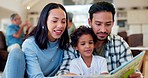 Happy dad, mom and child reading book in home for learning, language development and teaching support. Father, mother and boy kid relax with big family for quality time, storytelling and conversation