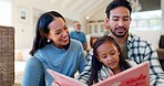 Happy father, mother and child reading book in home for learning, language development or support in lounge. Dad, mom and girl kid relax with big family for quality time, storytelling or conversation