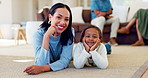 Family, children and a mother with her daughter on the floor of a living room together in their home. Portrait, smile and a young woman with her happy girl child in their house to relax while bonding