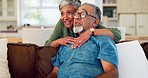 Watching tv, old man and woman hug sofa in lounge with love, smile and relax in home together. Marriage, movies and senior couple embrace on couch in apartment with happiness in retirement together.