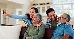 Family, selfie and senior couple relax on a sofa, bond and enjoy the weekend together in their home. Love, photo and adult siblings with elderly parents in living room for profile picture or memory