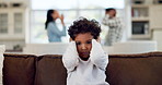 Divorce, trauma and a boy with parents fighting in the home during marriage problems, conflict or domestic violence. Stress, anxiety or fear with a male child scared at mom and dad shouting in anger