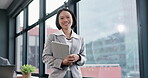 Asian woman, face and tablet by window in office for professional, legal and attorney about us for law firm. Portrait, smile and confident lawyer with digital technology for litigation consulting