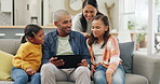 Family, father and mother streaming  with children on a tablet watching a show or movie with subscription online. Web, website and parents relax with kids on a sofa or couch watching on an app