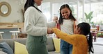 Excited, energy and mother dancing with her kids to music in the living room of their family home. Happy, bonding and young mom moving and jumping with her girl children to a song, playlist or radio.