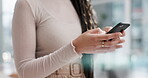 Business woman, hands and phone typing for networking, online browsing or research at office. Closeup of female person or employee on mobile smartphone app for social media communication at workplace