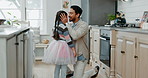 Ballet, hug and father with daughter in kitchen for support, love and creative. Happy, ballerina and music with man and young girl dancing in family home for learning, dance or happiness together