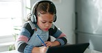 Homework, thinking and child with headphones, writing exam and learning with tablet for virtual classroom. Elearning, studying and smart girl with home school in kitchen for online class project.