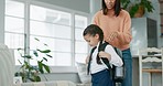 Mother, child and backpack for school at home while ready to start education. A young woman and girl kid or student in uniform and a bag leaving for first day at elementary while in a family house