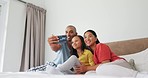 Bed, selfie and family with happiness, love and bonding with fun, happy memory and loving together. Picture, parents and child in a bedroom, home and female kid with mother, father and social media
