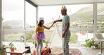 Fantasy, dance and a father with his daughter for fun while playing together as king and princess in their home. Love, family or kids with a man parent and happy female child bonding in a house