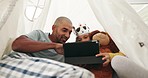 Father, tablet and girl in tent in home for learning, streaming online movie or video, film or social media on web. Dad, technology and relax with happy child with crown, bonding and smile together