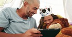 Tablet, dad and kid in tent in home for learning, streaming online movie and video, film and social media. Father, technology and relax with happy girl with teddy bear, crown and bonding together.