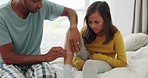 High five, happy and father with first aid for a child, support and plaster in the bedroom. Excited, house and a dad helping a girl with a medical emergency on the bed after an injury with care