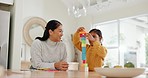 Bonding, smile and mom playing with building blocks with her kid in the kitchen for child development at home. Happy, love and young Asian mother helping her daughter with wood toys for fun at house.