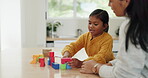 Mother, daughter and building blocks, puzzle and learning with education toys, development and bonding at home. Woman, young girl and growth, help and support with love, trust and academic games