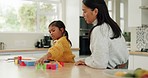 Woman, girl and building blocks, puzzle and learning with education toys, development and bonding at home. Mother, young daughter and growth, help and support with love, trust and academic games