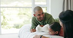 Smile, family and parents with teddy bear in bedroom, bonding and relax together. Father, mother and girl child with stuffed animal, toys and happy, play and enjoying quality time on bed in house