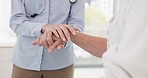 Doctor, helping hands and senior man at hospital for help, trust and healthcare consultation. Empathy, hand holding and specialist with old guy at a clinic for bad news, results or cancer diagnosis 