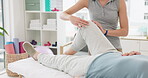 Physiotherapy, massage and medical treatment for patient with an injury for recovery as therapy rehabilitation. Joint, health and physiotherapist help person or client with knee motion and support