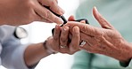 Hands, diabetes test and a doctor with a patient for a healthcare check with a finger prick. Closeup, service and a nurse with a person and machine for sugar or glucose exam from a blood sample