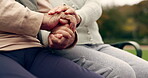 Relax, empathy and support with old couple holding hands on park bench for community, love and community. Care, retirement and nature with closeup of senior people in outdoors for collaboration