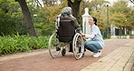 Nurse, relax and park with old woman in a wheelchair for retirement, elderly care and physical therapy. Trust, medical and healthcare with senior patient and caregiver in nature for rehabilitation