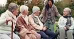 Friends, happy and senior people in park for bonding, conversation and quality time together outdoors. Friendship, retirement and elderly man and women with caregiver on bench for relaxing in nature