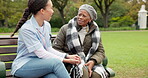 Nurse, happy and relax with old woman on park bench for retirement, elderly care and conversation. Trust, medical and healthcare with senior patient and caregiver in nature for nursing rehabilitation