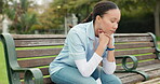 Sad, tired and nurse with woman on park bench for thinking, fatigue and burnout. Mental health, anxiety and depression with female person in nature for frustrated, exhausted and healthcare problem