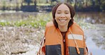 Girl, nature and lifejacket in portrait for adventure in summer for fun with travel on river. Outdoor, lake and sport with female person on vacation with water for safe journey with trees or tourist