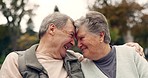 Forehead, touch and senior couple in a park with love, happy and conversation with romantic bonding. Fun, old people and elderly man embrace woman with care, romance or soulmate connection outdoor