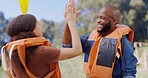 Kayak, high five and couple by lake for rowing on holiday, vacation and adventure in nature. Water sports, travel and black man and woman with lifejacket excited for kayaking, canoeing or paddle boat